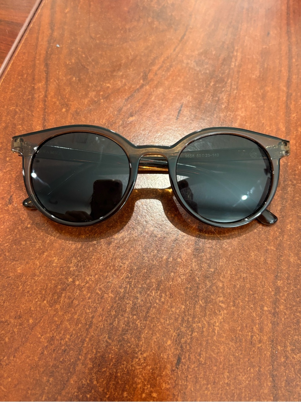 Classic Round Women’s Sunglasses - transparent brown frame and Black Lenses